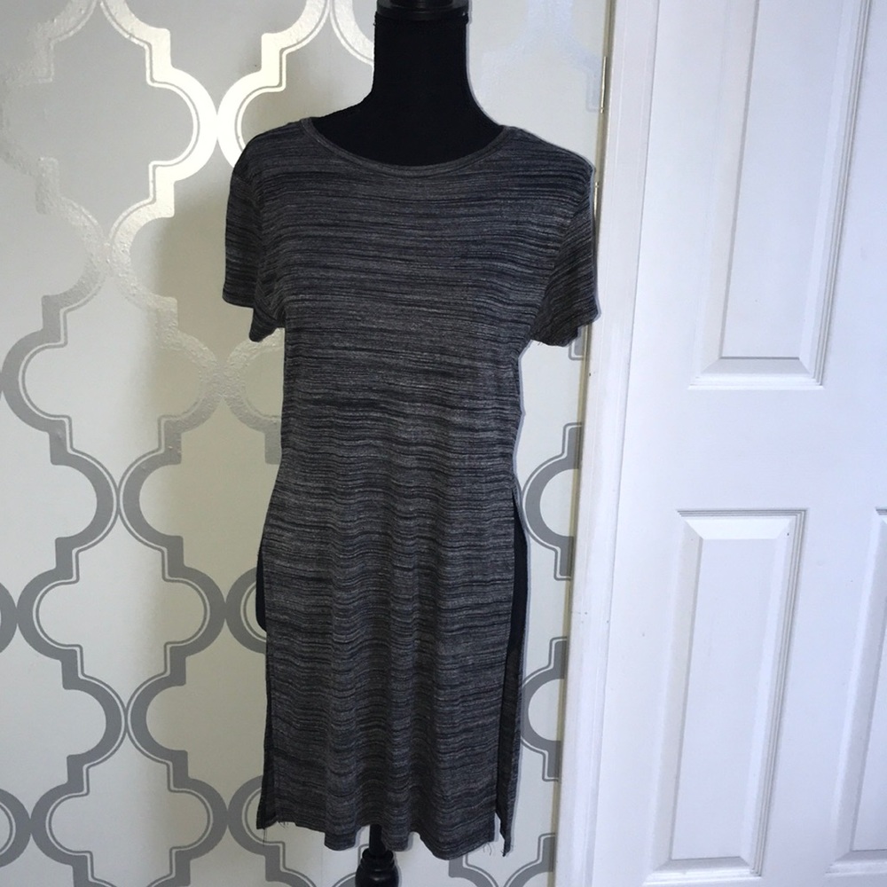 Never been worn ! Shirt with side slits !